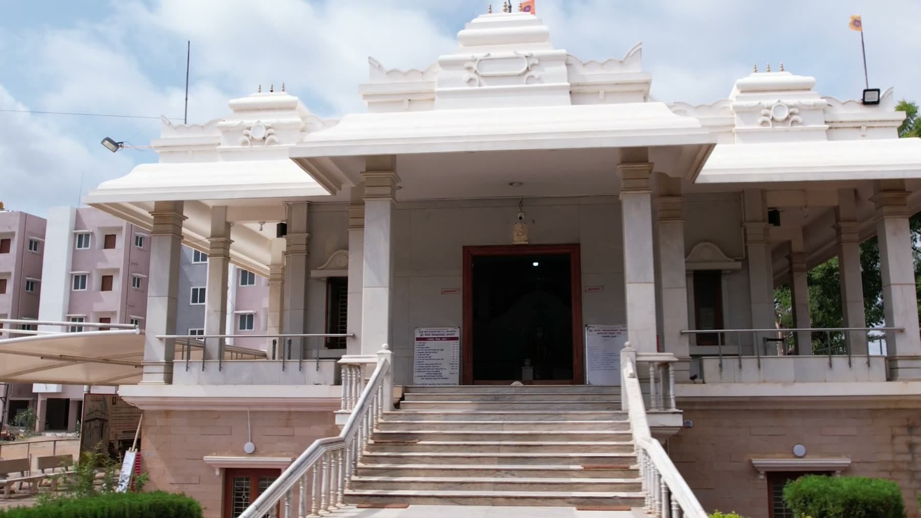The temple in Gadag: a white stone mandapa above a broad flight of steps.